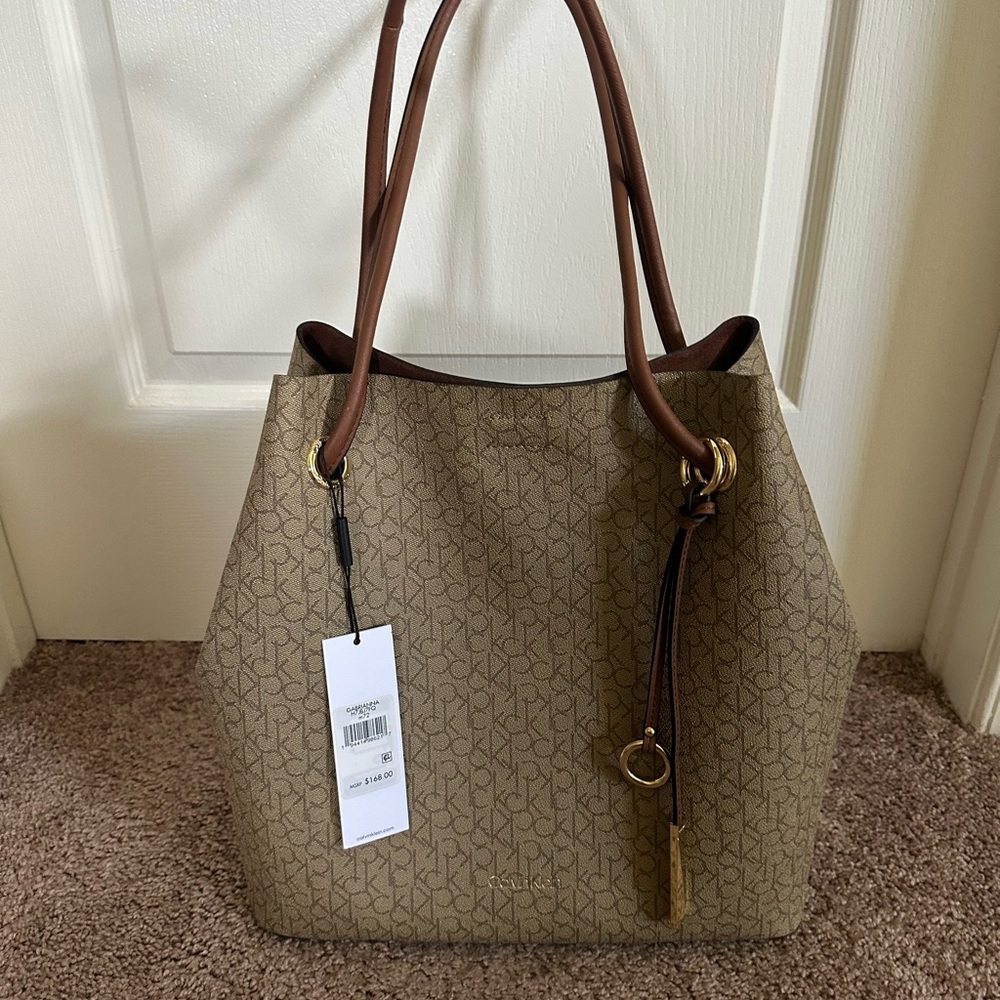 Calvin Klein beautiful nuetral bag with free accessories bag included